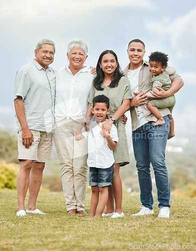 Image of Portrait, smile and family outdoor, love and carefree with happiness, cheerful and bonding together. Face, happy grandparents and mother with father, kids and children outside, freedom and loving