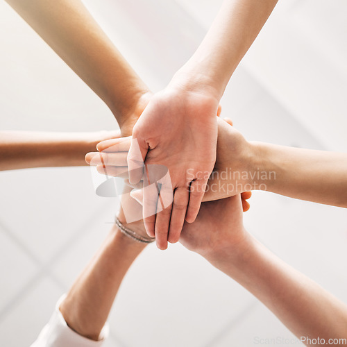 Image of Hands stacked, teamwork and group of people in support, collaboration goals and community or solidarity from below. Circle, women and team work, faith or together sign isolated on a white background