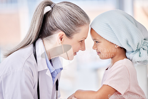 Image of Smile, doctor and child on bed in hospital for children, health and pediatrician with support in cancer treatment. Pediatrics, healthcare and kid, happy medical professional with young clinic patient