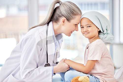 Image of Smile, pediatrician and child holding hands on bed in hospital for children, health and support in cancer treatment. Pediatrics, healthcare and happy kid, doctor with young patient for health care.