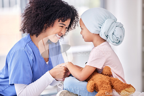 Image of .Support, nurse and child holding hands on bed in hospital for children, health and smile at cancer treatment clinic. Pediatrics, healthcare and kids, nursing caregiver together with young patient.