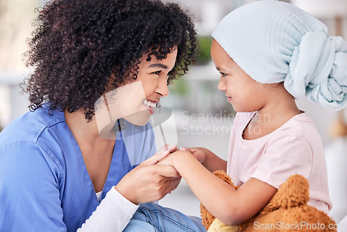 Image of Smile, nurse and child on bed in hospital for children, health and medicine, support and trust in cancer treatment. Paediatrics, healthcare and kid, nursing caregiver holding hands with young patient