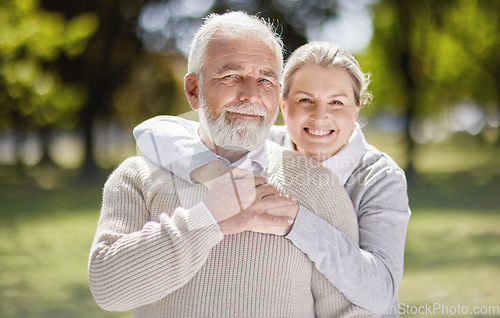 Image of Old couple hug in park with love and smile in portrait, retirement together with trust and support with care. Elderly man, woman and marriage with commitment, relationship and happy people outdoor