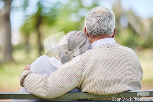 Image of Back view of old couple, hug in park with love and view of nature, retirement together and peace. Elderly man, woman and marriage with commitment, relationship and pension with trust and care outdoor