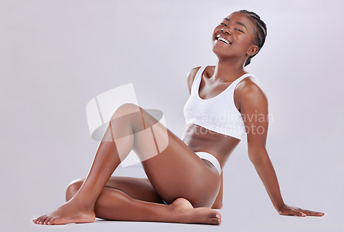 Image of Body, underwear and legs model with cosmetic beauty, wellness and isolated in a white studio background. Luxury, skincare and portrait of person or woman for empowerment and health on the floor