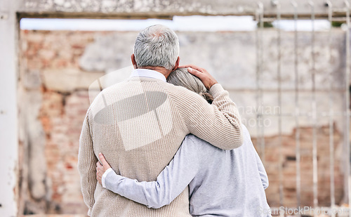 Image of Sad, insurance and disaster with old couple at house for homeless, comfort and accident. Fire risk, loss and destruction with senior man and woman at building for depression, ruin and damage