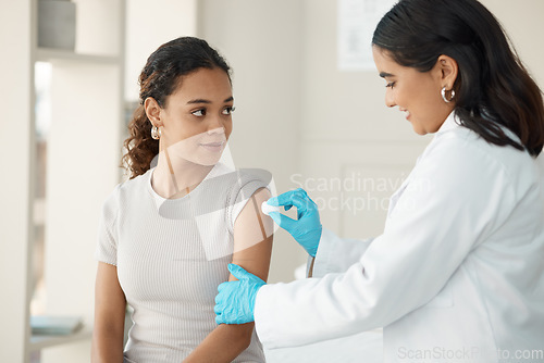 Image of Patient, consultation and cotton with doctor for vaccine for wellness and safety from virus. Healthcare, hospital and disinfect woman for vaccination with a smile to help with medicine for arm.