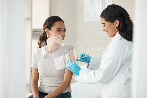 Image of Injection, vaccine and patient at the clinic for consulting and help with prevention with a smile. Doctor, inject and woman on arm for virus with gloves in medical room for wellness or health.