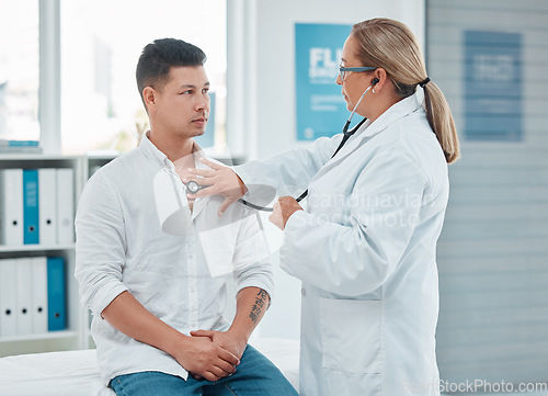 Image of Healthcare, doctor test with man patient and consultation with stethoscope at a hospital room. Cardiology or health wellness, medicine and surgeon medical exam with a male person in a clinic building