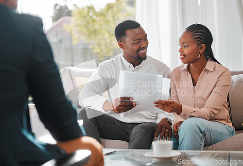 Image of Contract, married couple with financial advisor and documents in a living room of a home. Investment or investment, paperwork and planning with people in a meeting sitting on furniture together