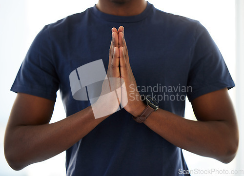 Image of Hands, worship and man praying in studio in hope of help, guidance and gratitude in white background. Hand, pray and male person in prayer to Jesus Christ, humble and spiritual, holy and Christianity