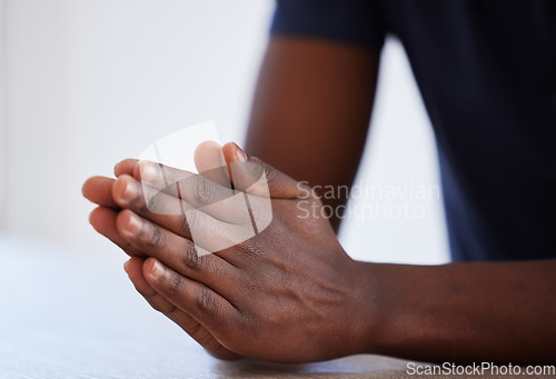 Image of Worship, hands and man praying in studio in hope of help, guidance and gratitude in white background. Hand, pray and male person in prayer to Jesus Christ, humble and spiritual, holy and Christianity