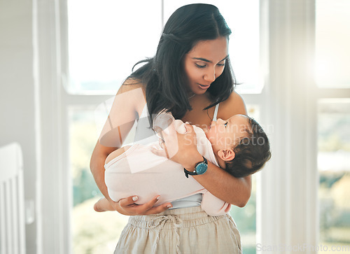 Image of Family home, mother and holding baby with love, security and support. Woman or mom talking to girl child to relax or sleep in a house for development, wellness and growth with care on mothers day