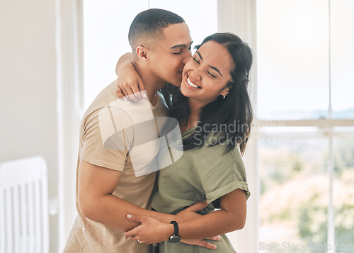 Image of Happy couple, kiss and hug in home of love, intimacy and relax for romance, bonding and trust together. Young man, woman and kissing partner for quality time, care or happiness in loving relationship