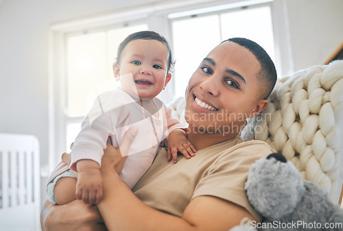 Image of Dad, holding baby and portrait in a family home for bonding, security and quality time. Man or father and girl child relax and smile together on lounge sofa for development, trust and support or care
