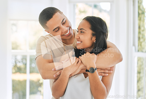 Image of Couple, love and hug in home for happiness, intimacy and relax for romance, support and trust of bonding together. Happy man, woman and hugging partner for quality time, care and smile for commitment