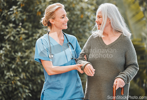 Image of Support, care and caregiver walking senior woman in a garden to relax, wellness and morning exercise in the lawn. Trust, nursing home and nurse help elderly person happy and smile for an outdoor walk