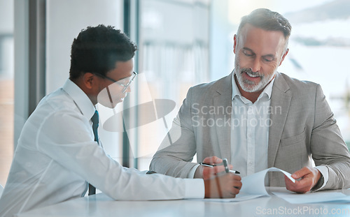 Image of Human resources, contract or signature with a business man and candidate for a vacancy meeting in an office. Manager, recruitment and opportunity with signing of documents for hiring in a boardroom