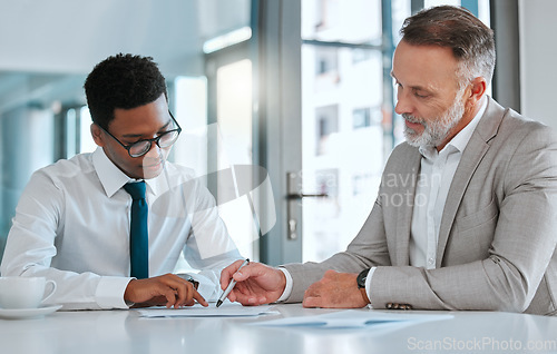 Image of Human resources, hiring and contract with a business man and candidate for a vacancy meeting in an office. Manager, recruitment and interview with an hr person reading a cv or resume in the boardroom