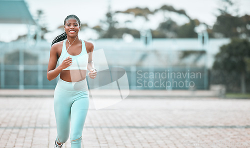 Image of Portrait, city and black woman running, workout goal and exercise for wellness, sports and training. Face, female person and runner with earphones, cardio and athlete with self care and stress relief