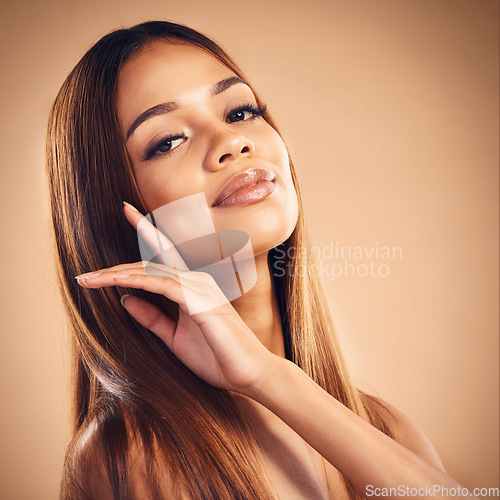 Image of Beauty, hand in hair and portrait of woman in studio for wellness, keratin treatment and haircare. Salon, hairdresser and face of female person on orange background for growth, shine and texture