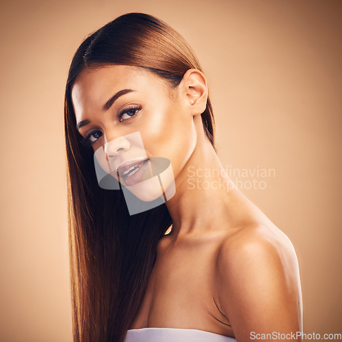 Image of Hair, salon and portrait of woman in studio for wellness, keratin treatment and haircare aesthetic. Beauty, hairdresser and face of female person on brown background for growth, shine and cosmetics