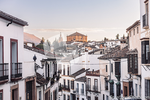 Image of Views of the medieval village of Ronda with white Andalusian houses and the gothic style church of Santuario de Maria Auxiliadora. Malaga, Spain.