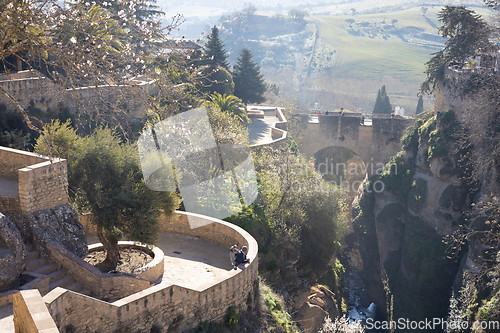 Image of Panoramic view of hanging gardens of Cuenca over El Tajo Gorge with whitewashed houses of Ronda, Andalusia, Spain.