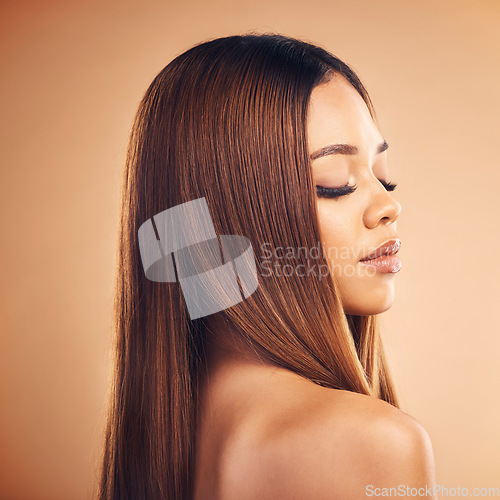 Image of Hair care, beauty and face of woman in studio for wellness, keratin treatment and makeup. Salon, hairdresser and profile of female person on brown background for growth, texture style and cosmetics