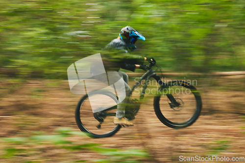 Image of Motion blur, mountain bike and person cycling in forest for adventure, speed and fast power. Athlete, extreme sports and bicycle for outdoor action, off road transport and cardio race for adrenaline