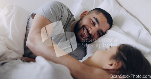 Image of Face, happy man and relax with woman in bed, room and enjoy romance of quality time together at home. Couple, relationship and bonding in morning for love, care and happiness for partner on honeymoon