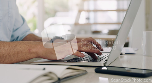 Image of Hands, man and laptop keyboard at table for planning, online research and working on internet. Closeup, computer and typing on technology for website connection, email and digital copywriting at desk