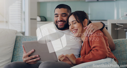 Image of Tablet, couple and laughing on couch in home for social media, funny news and online meme. Happy man, woman and relax with digital technology, subscription and streaming comedy on network connection