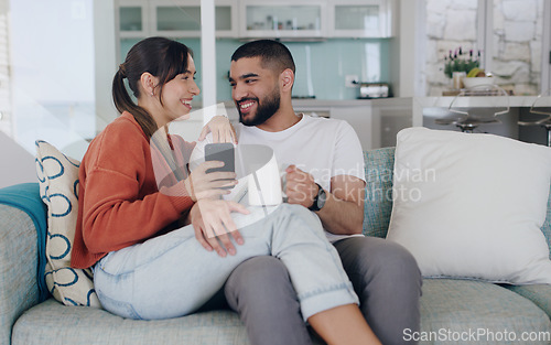 Image of Happy, couple and cellphone on sofa in living room with social media post, online subscription and mobile app. Man, woman and smartphone for digital connection, technology and coffee to relax at home
