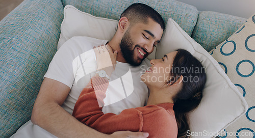 Image of Top view of happy couple, love and hug on sofa in living room for romance, intimacy and relax together at home. Young man, woman and cuddle partner on couch for relationship, quality time and care