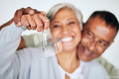 Image of Senior couple, portrait and keys in hand with smile for new home, real estate deal or property for happy retirement. Elderly woman, man and excited face for investment in house, apartment or mortgage