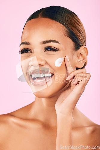 Image of Skincare, beauty cream and face of woman in studio with cosmetics product or dermatology on pink background. Model, skin care or luxury makeup moisturizer, sunscreen or salon facial treatment