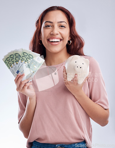 Image of Money, portrait or happy girl with a piggy bank for financial wealth or savings on white background. Finance, investment or woman smiling or investing Euros or budget in tin for safety or security