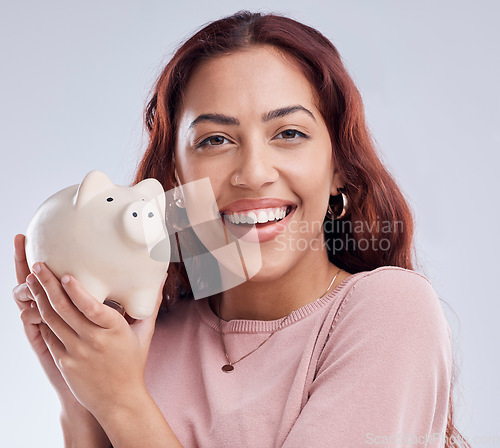 Image of Smile, portrait or happy woman with a piggy bank for financial wealth or savings on white background. Finance, investment or girl smiling or investing cash or budget in tin for safety or security