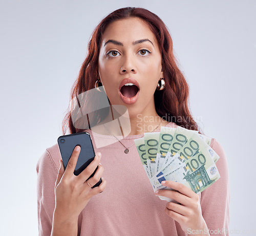 Image of Investment, money or shocked woman with phone for online investment on digital fintech in studio. Financial mobile app, ecommerce payment or surprised girl typing banking data on internet with Euros