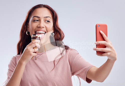 Image of Woman, ice cream and selfie with smile in studio for summer vacation, social media app and blog by white background. Girl, gelato or dessert with photography, profile picture and happy by backdrop