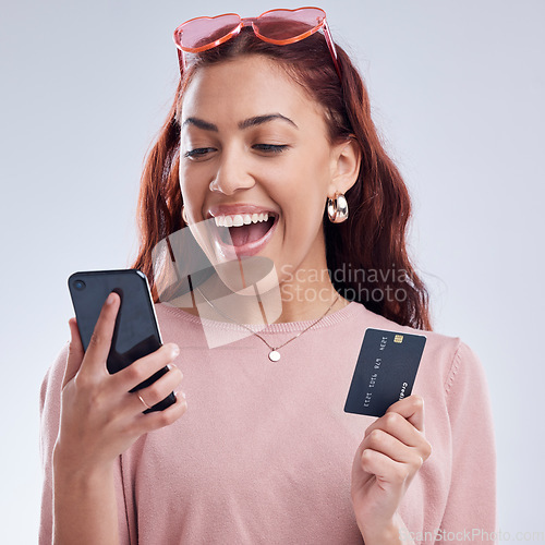 Image of Investment, phone or happy girl with credit card for online investment on digital fintech in studio. Financial mobile app, ecommerce payment or excited gen z woman typing banking data on internet