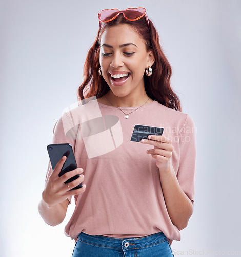 Image of Finance, phone or excited girl with credit card for online investment on digital fintech or web in studio. Financial mobile app, ecommerce payment or happy gen z woman typing banking data on internet