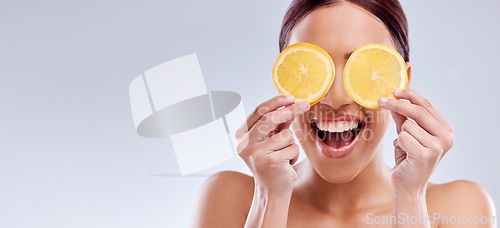 Image of Skincare, mockup or happy woman with orange as natural facial with citrus or vitamin c for wellness. Studio background, smile or healthy girl model smiling with organic fruits for dermatology beauty