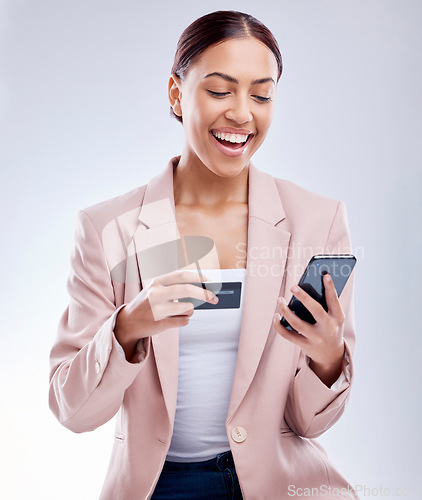 Image of Investment, phone or happy businesswoman with credit card for online investment on digital fintech in studio. Financial mobile app, ecommerce payment or funny person typing banking data on internet