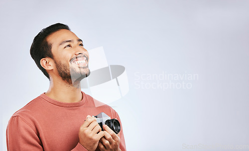 Image of Man with camera, photography and view with creativity, mockup space and art isolated on studio background. Happy male photographer, creative with artistic person smile and taking pictures with gadget