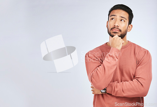 Image of Man, thinking and idea mockup in studio or planning, decision and choice with white background. Asian male, model and curious face with doubt, questions or confused guy try to remember with space