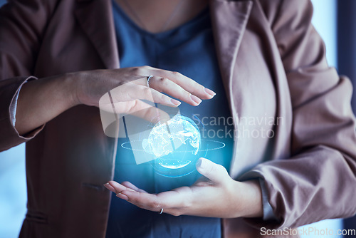 Image of Woman, hands and hologram earth in night at office for global network, communication and digital transformation. Female IT expert, 3d holographic world and cloud computing in dark workplace with ux