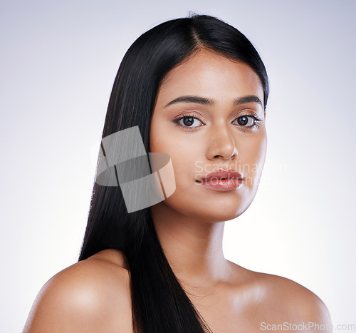 Image of Hair care, beauty and portrait of serious woman with long hairstyle and luxury salon treatment on white background. Growth, straight haircut and face of latino model from Brazil on studio backdrop.