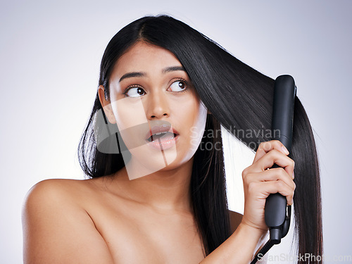 Image of Haircare, flat iron and face of woman with long hair, heat and luxury salon treatment on white background in Brazil. Beauty, straightener and latino model with straight hairstyle on studio backdrop.